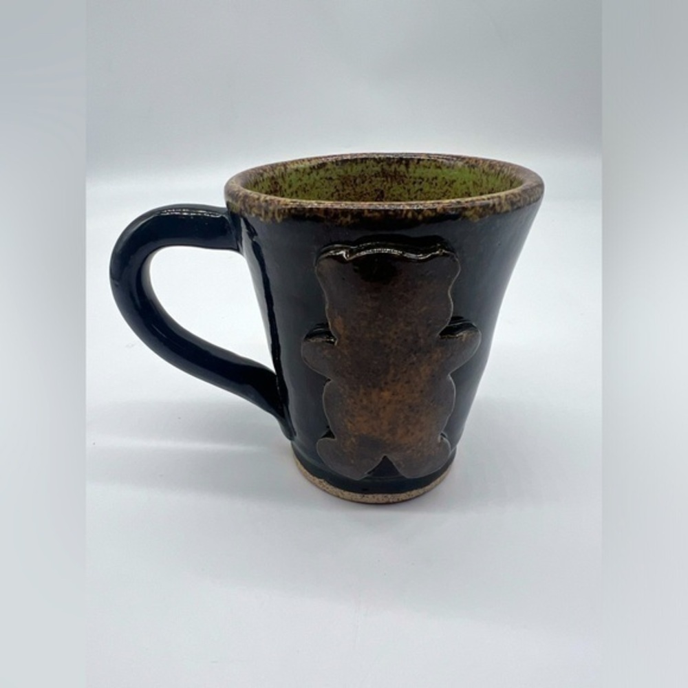 Handmade studio pottery mug with rustic bear design